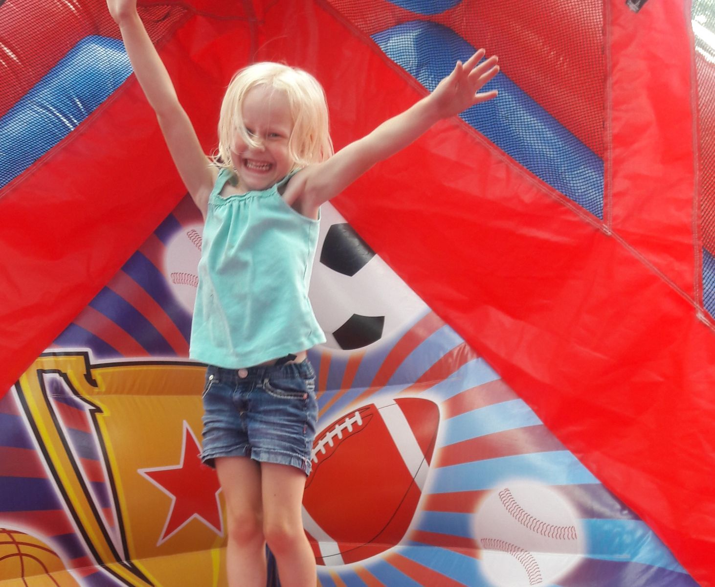 Girl jumping inside Sports Combo Inflatable